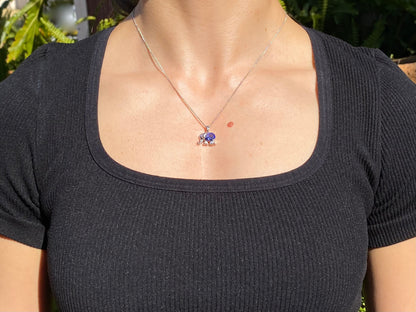 18K gold tanzanite and diamond elephant pendant.