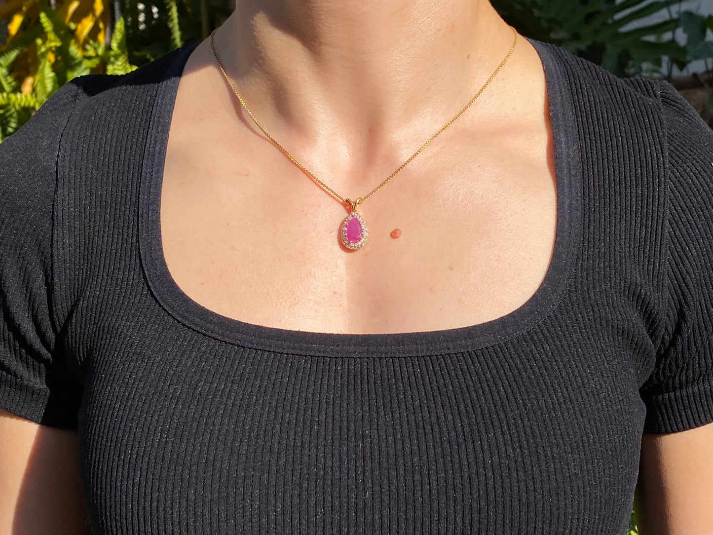 18K gold ruby and diamond pendant.