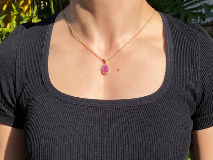 18K gold ruby and diamond pendant.