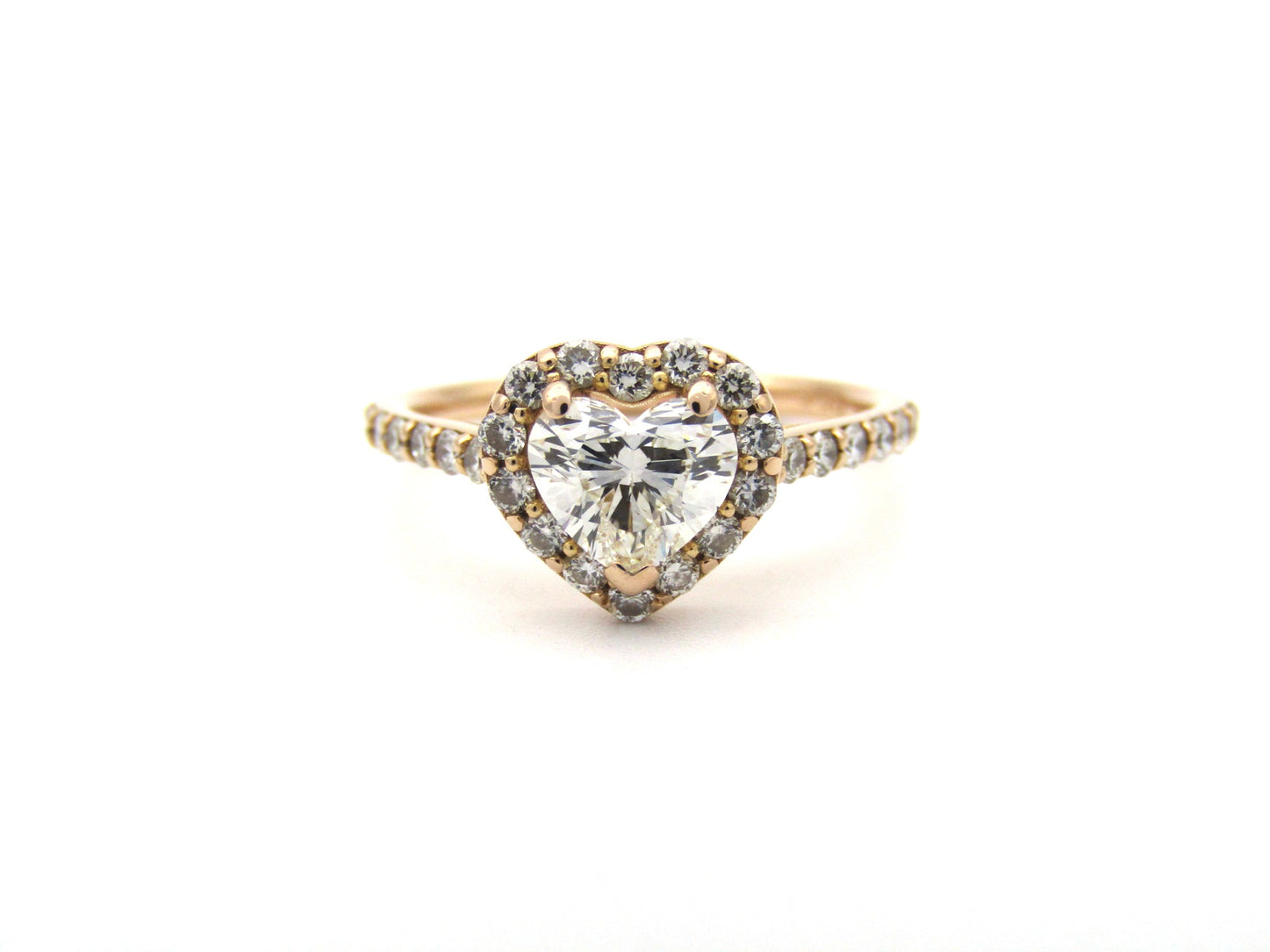 18K gold heart-shaped diamond halo ring.