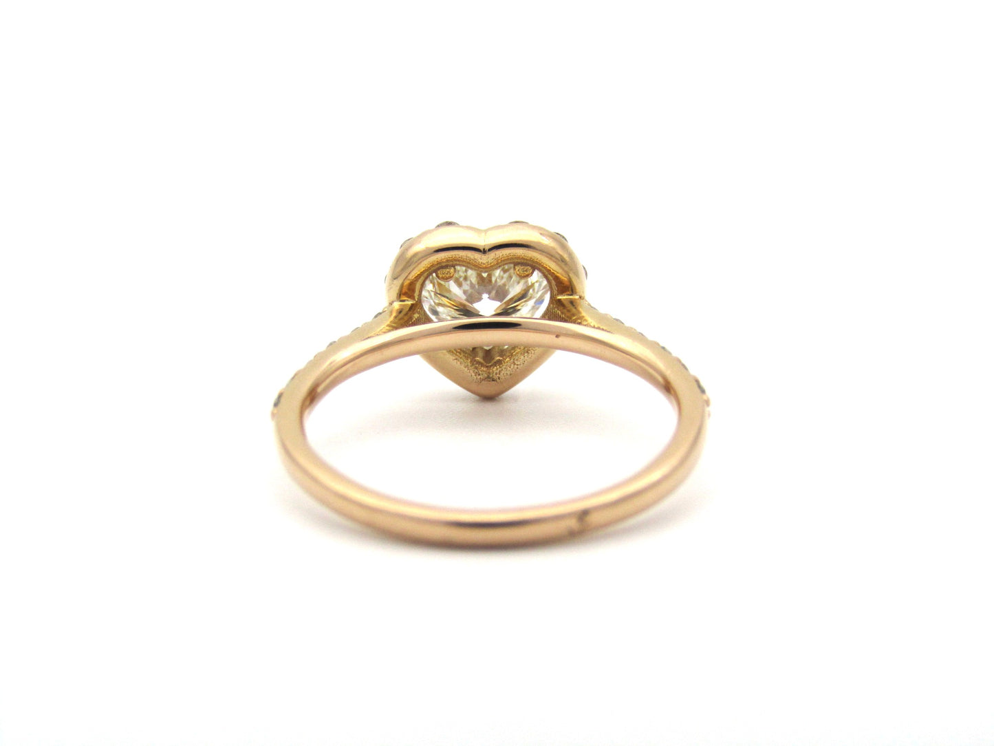 18K gold heart-shaped diamond halo ring.