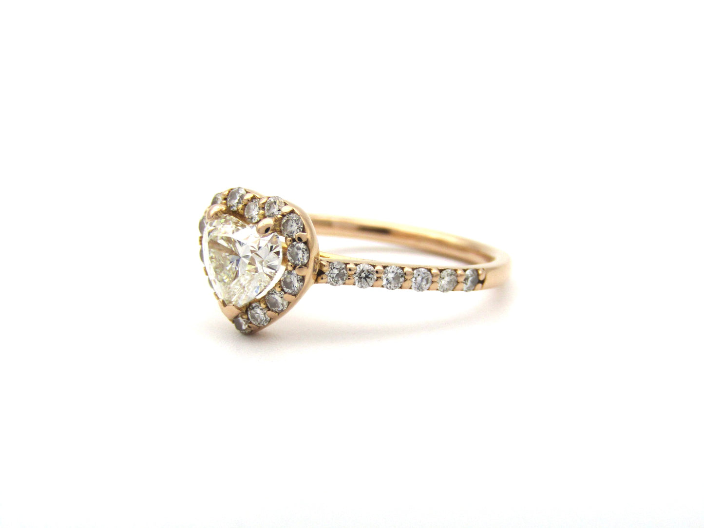18K gold heart-shaped diamond halo ring.