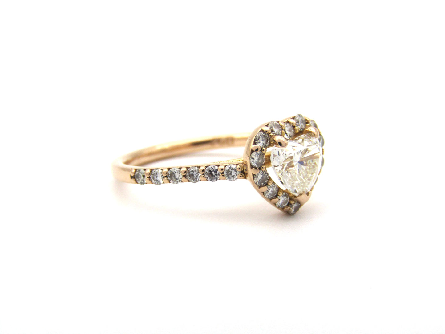18K gold heart-shaped diamond halo ring.