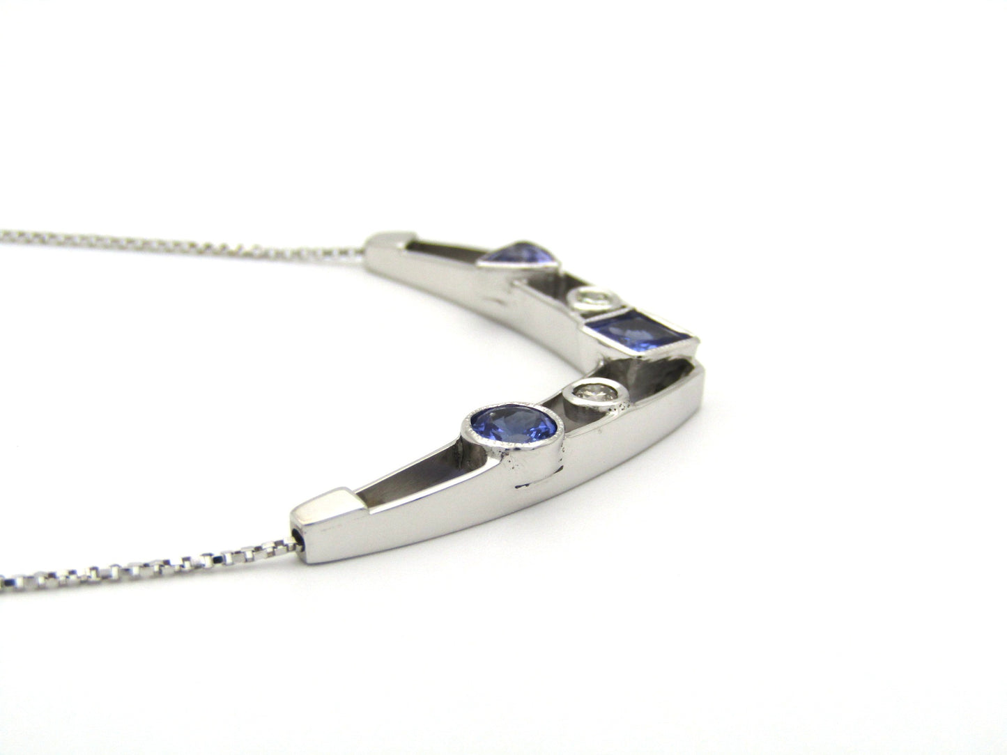 18K gold tanzanite and diamond necklace.