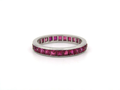 Platinum synthetic ruby eternity ring, circa 1990's.