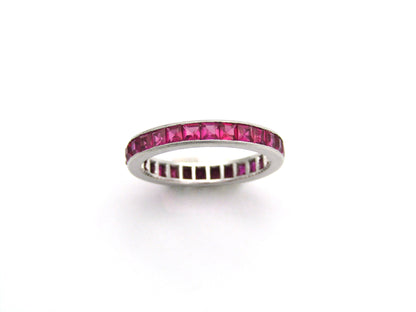 Platinum synthetic ruby eternity ring, circa 1990's.