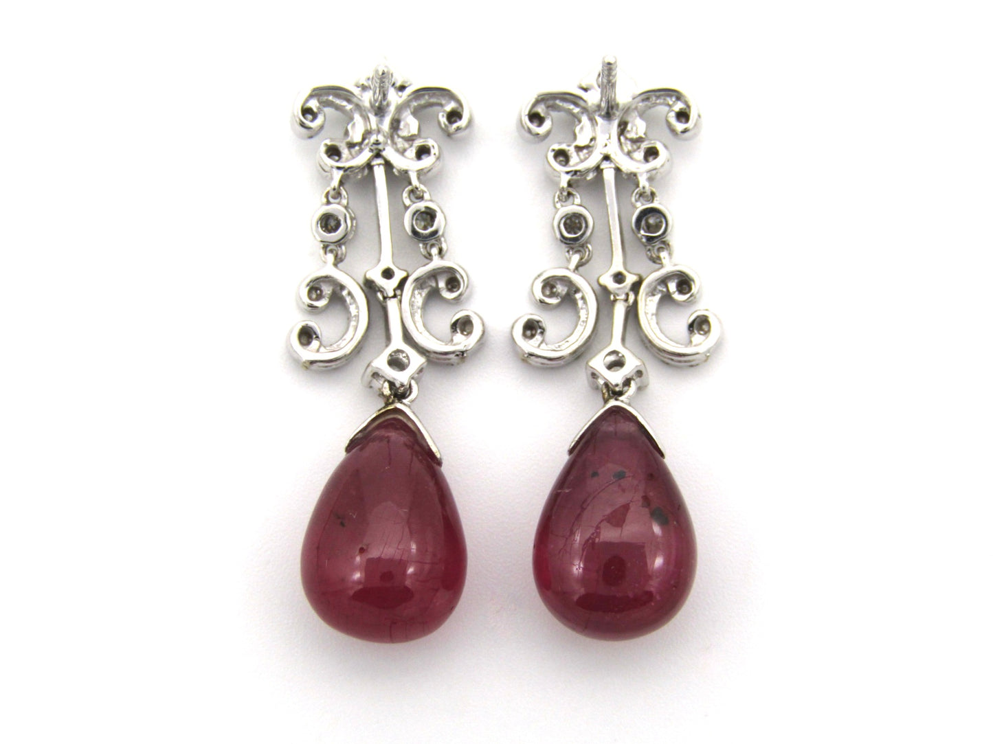 18K gold glass-filled ruby and diamond drop earrings.