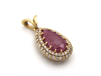 18K gold ruby and diamond pendant.