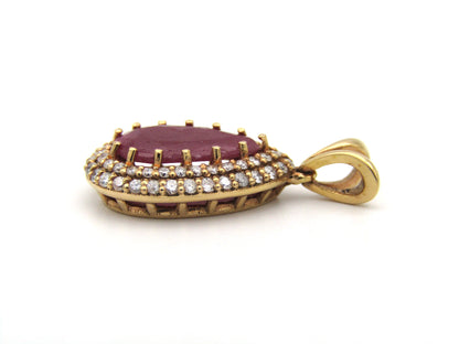 18K gold ruby and diamond pendant.