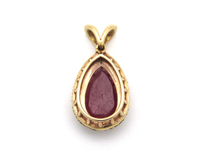 18K gold ruby and diamond pendant.