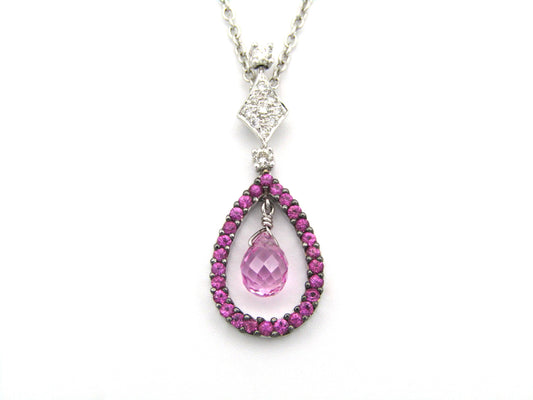 18K gold pink sapphire and diamond pendant.
