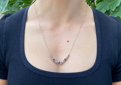 18K gold tanzanite and diamond necklace.