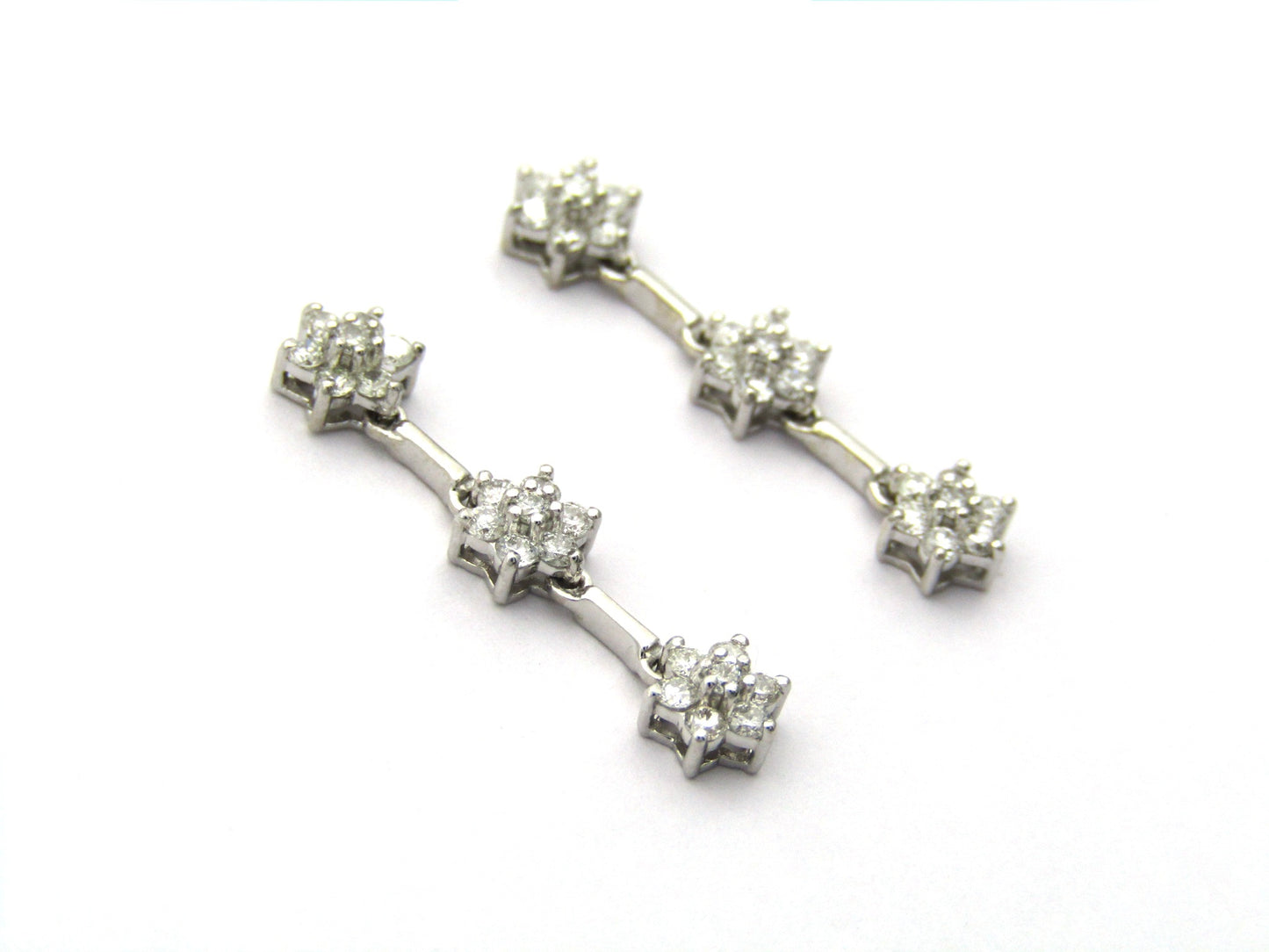 18K Gold diamond flower drop earrings by Browns
