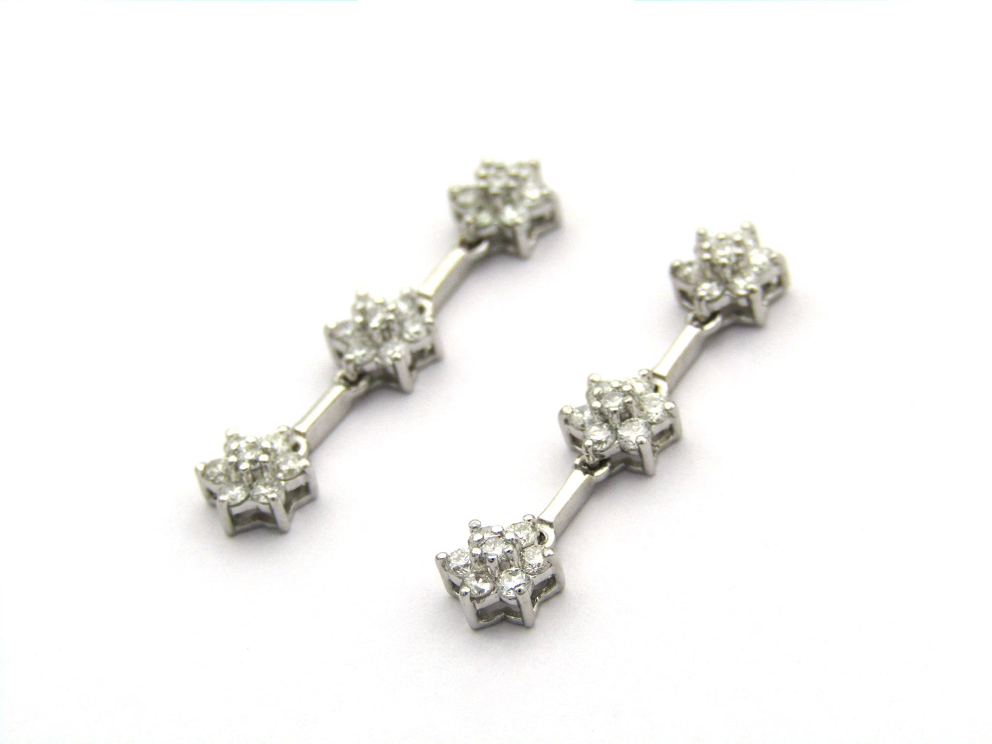 18K Gold diamond flower drop earrings by Browns