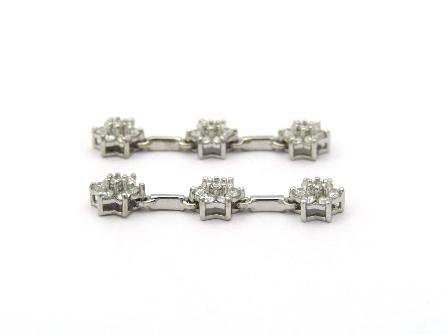 18K Gold diamond flower drop earrings by Browns