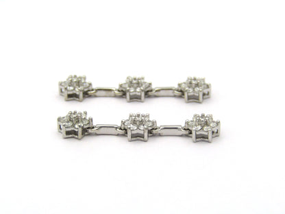 18K Gold diamond flower drop earrings by Browns