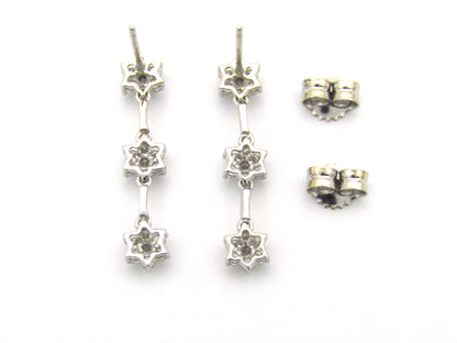 18K Gold diamond flower drop earrings by Browns