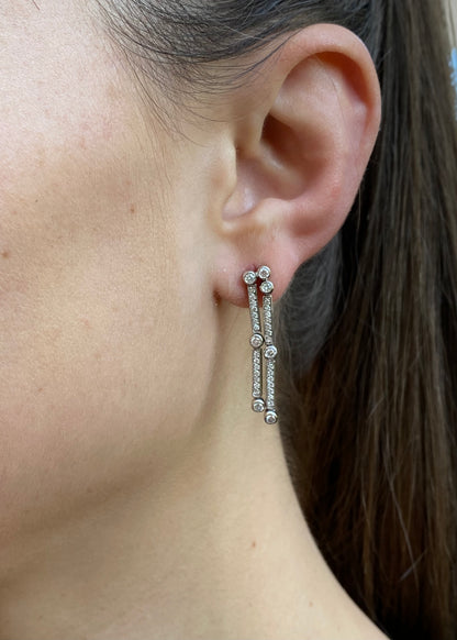 18K gold diamond drop earrings.