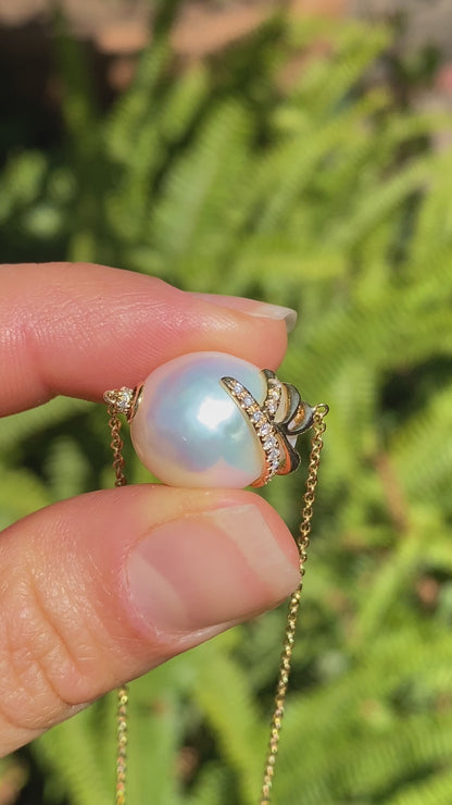 14K gold baroque pearl and diamond floating necklace.