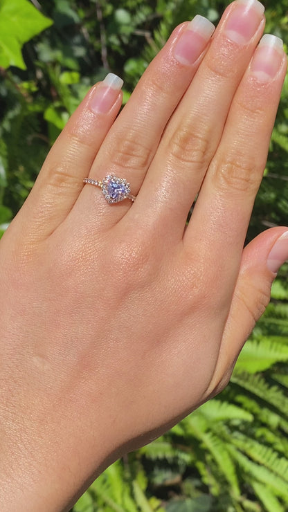 18K gold heart-shaped diamond halo ring.