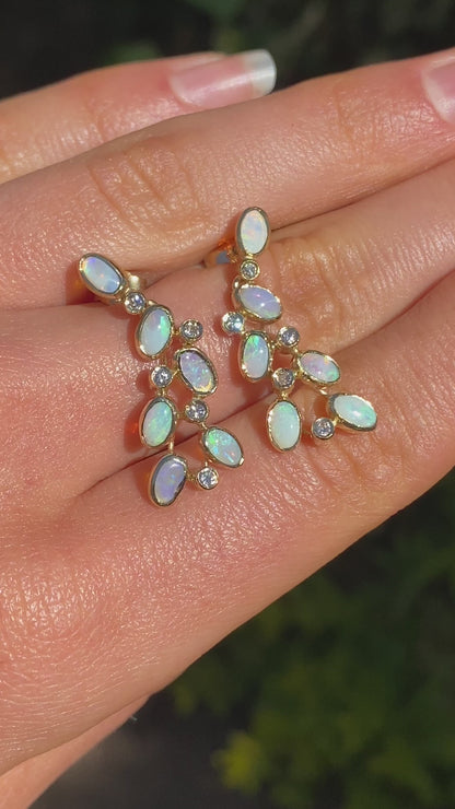 14K gold opal and diamond drop earrings.