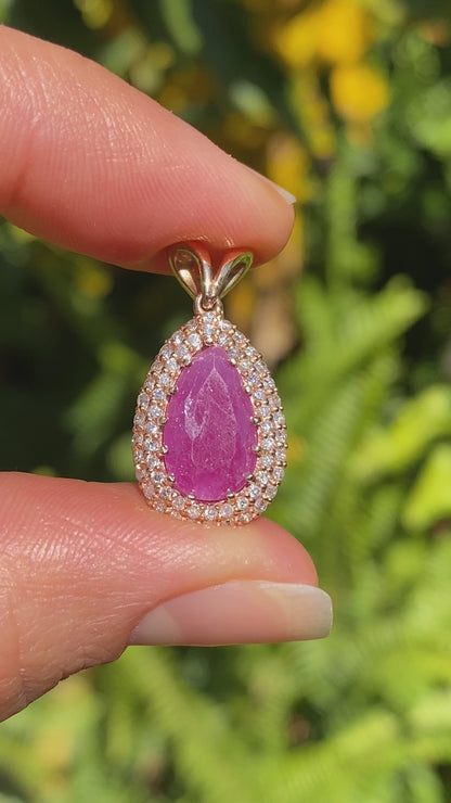 18K gold ruby and diamond pendant.