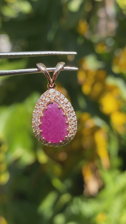18K gold ruby and diamond pendant.