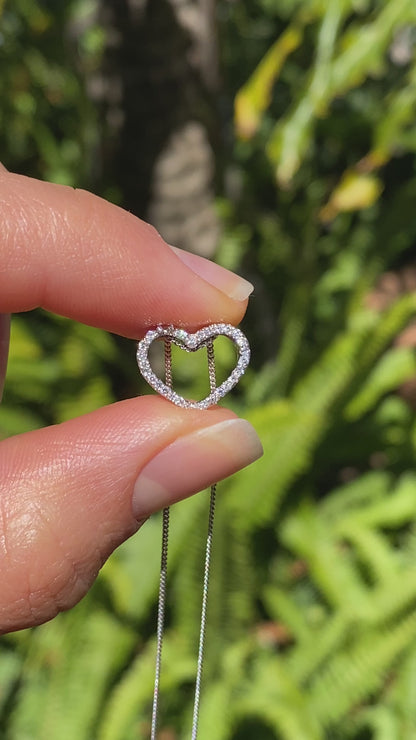 9K gold diamond heart pendant.