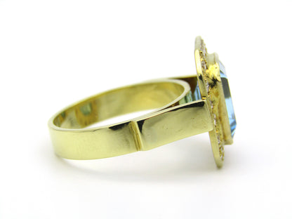 18kt yellow gold blue topaz and diamond ring.