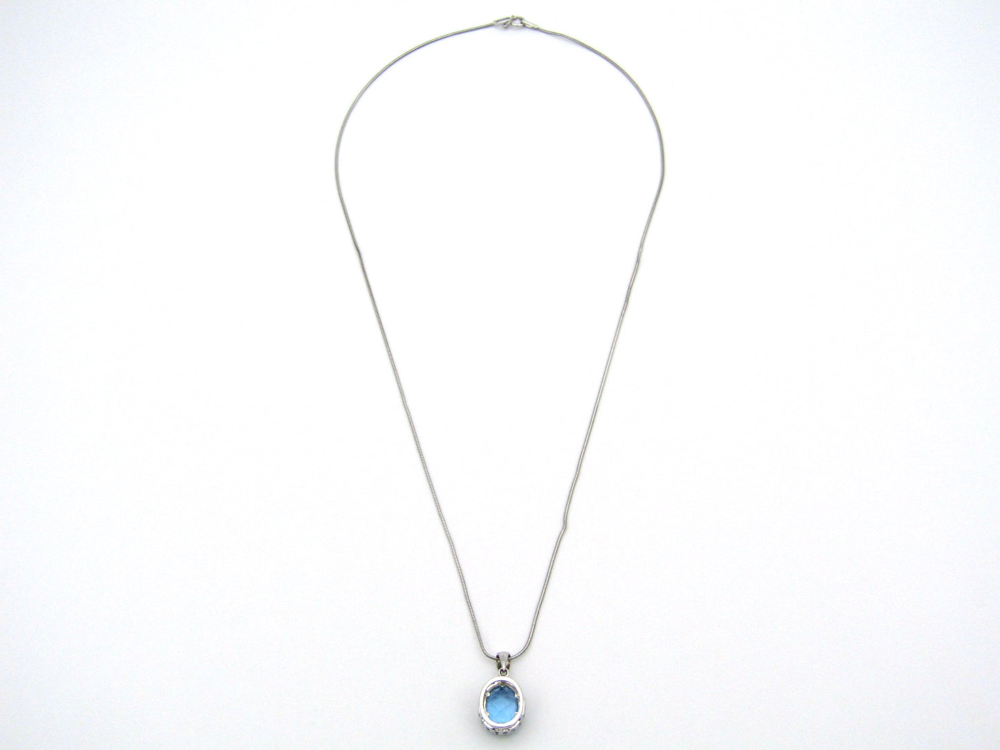 9K gold blue topaz and diamond pendant.