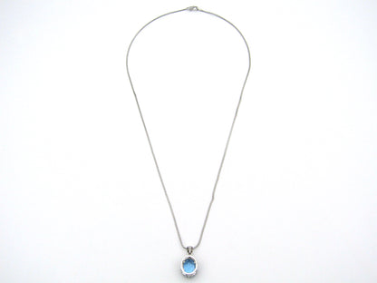 9K gold blue topaz and diamond pendant.