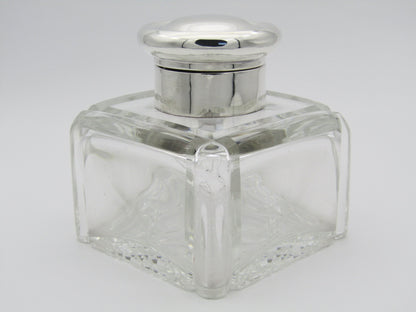 A silver mounted and cut glass desk inkwell by Asprey & Co. Ltd, Birmingham, 1915.