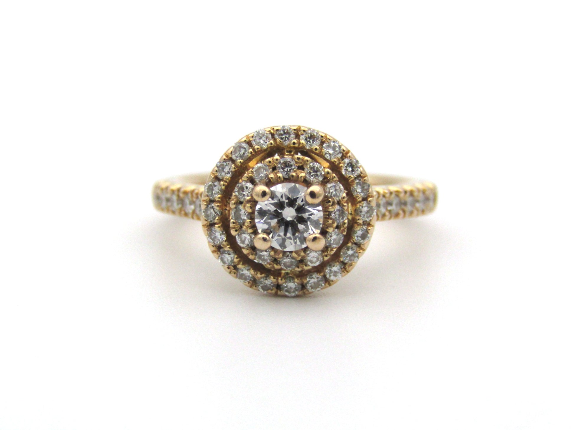 18K gold diamond halo ring.