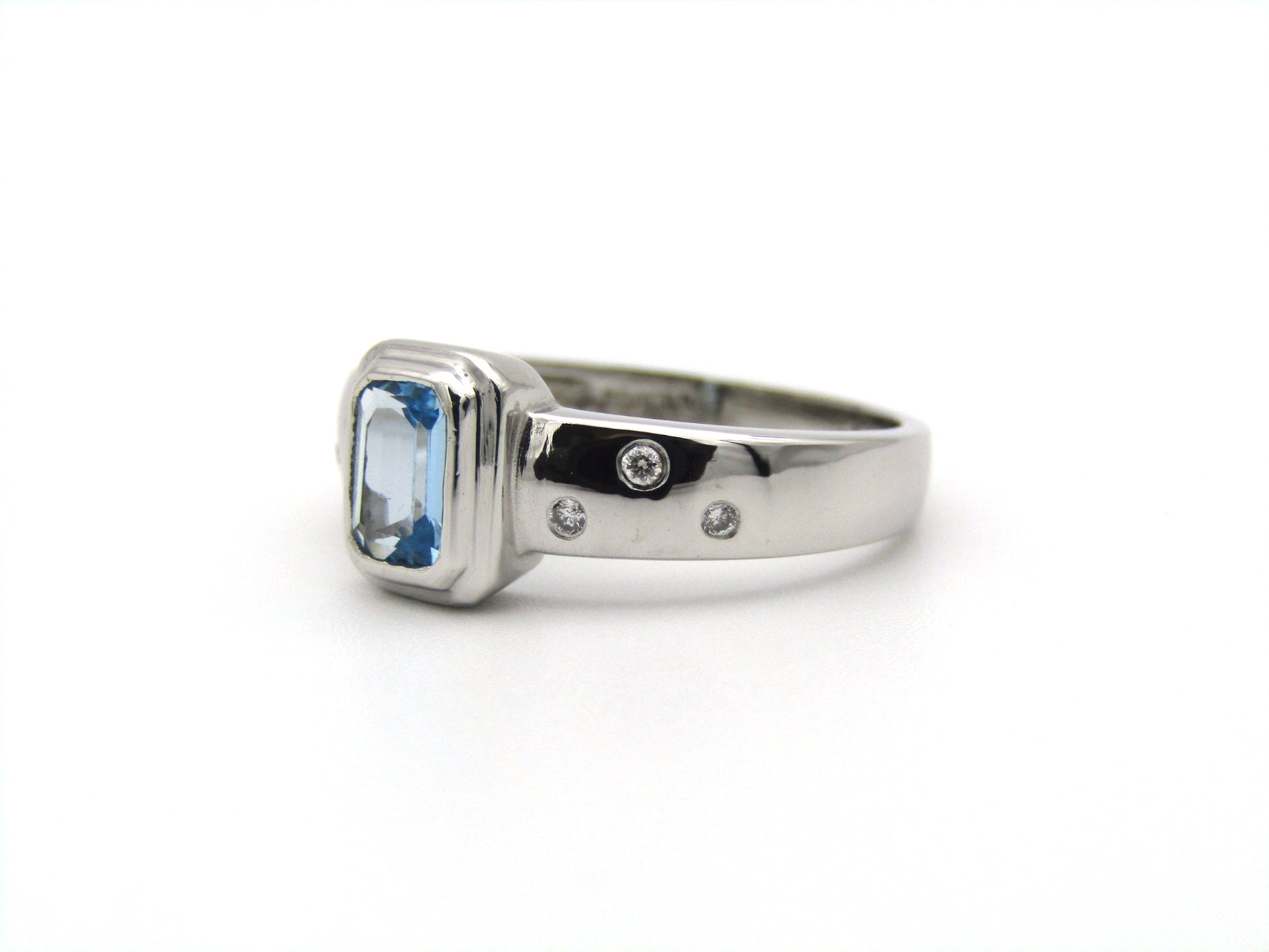 9K gold blue topaz and diamond ring by Browns.