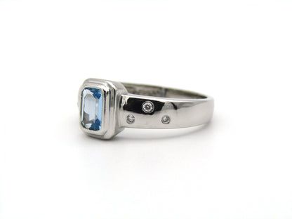9K gold blue topaz and diamond ring by Browns.