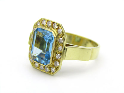18kt yellow gold blue topaz and diamond ring.