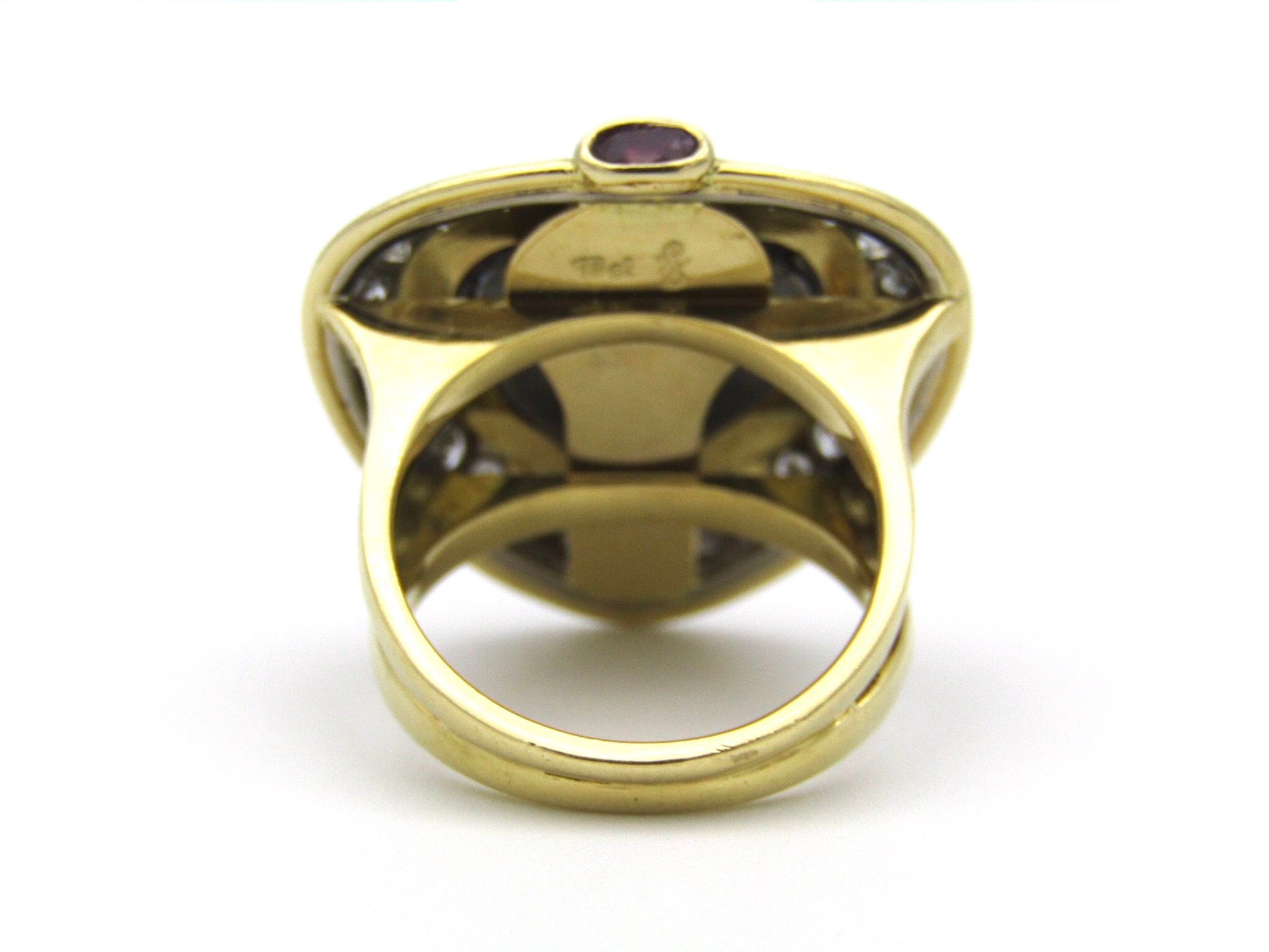 18kt gold amethyst, diamond, and ruby ring.