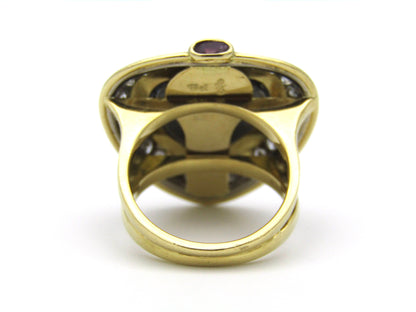 18kt gold amethyst, diamond, and ruby ring.