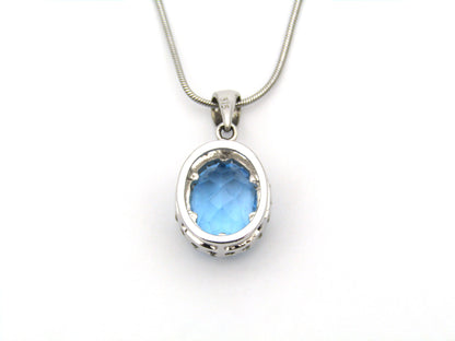 9K gold blue topaz and diamond pendant.
