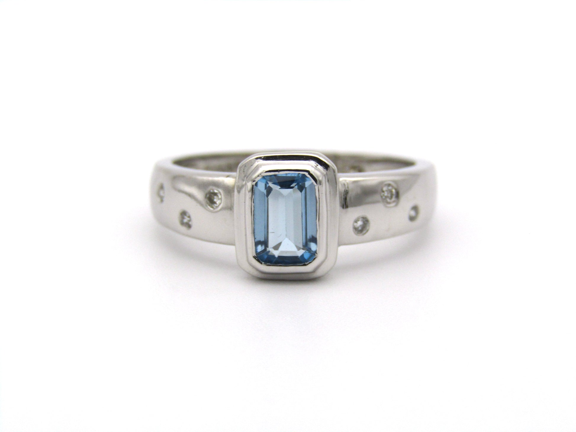 9K gold blue topaz and diamond ring by Browns.