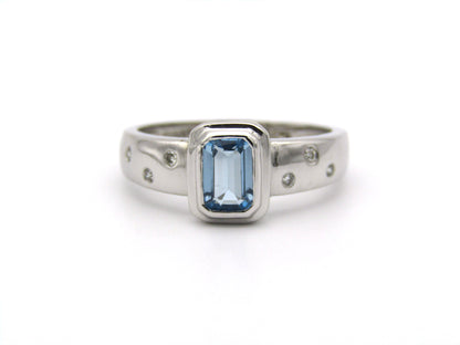 9K gold blue topaz and diamond ring by Browns.