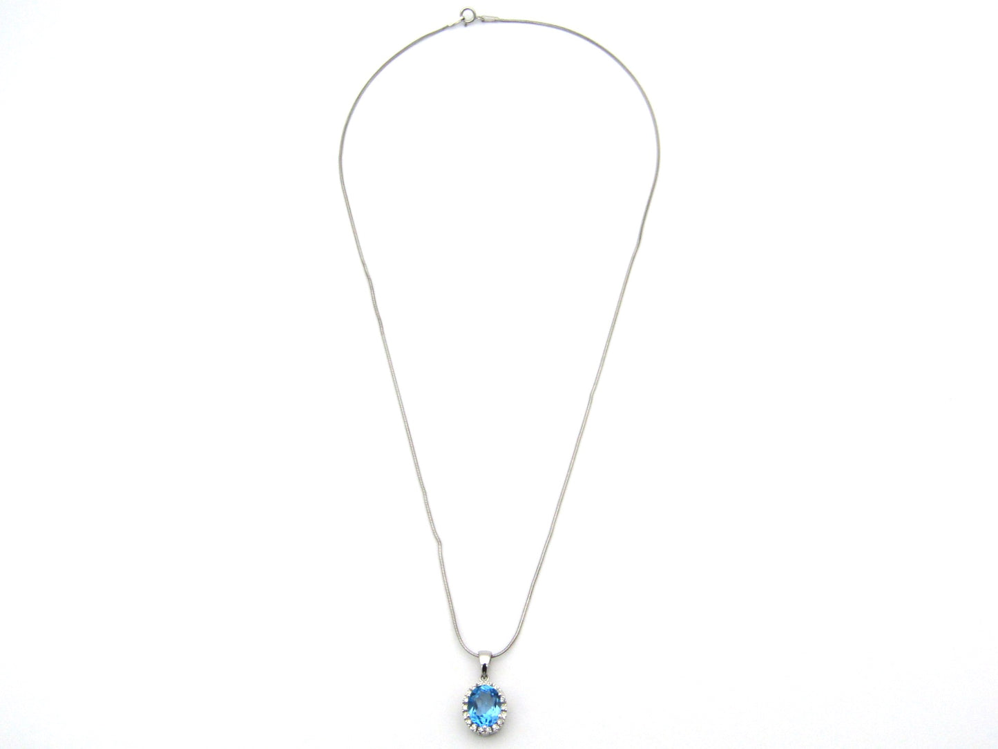 9K gold blue topaz and diamond pendant.