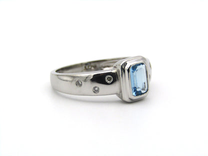 9K gold blue topaz and diamond ring by Browns.