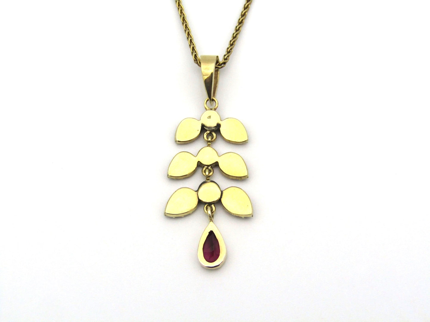 A Vintage 9K gold Almandine garnet and diamond pendant.