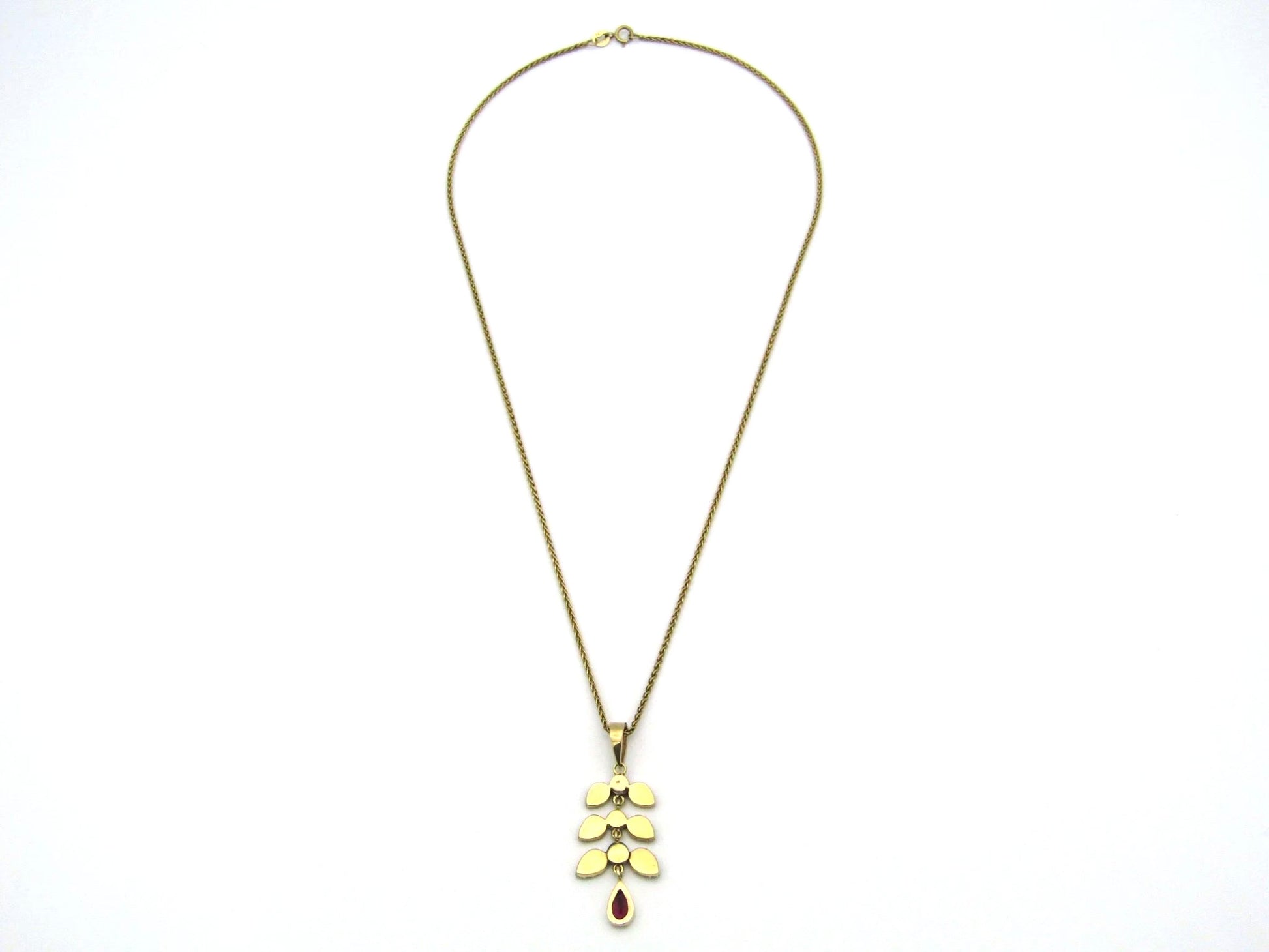 A Vintage 9K gold Almandine garnet and diamond pendant.
