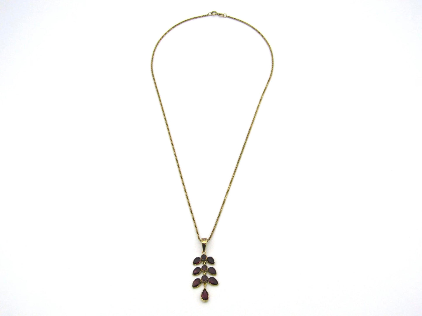 A Vintage 9K gold Almandine garnet and diamond pendant.