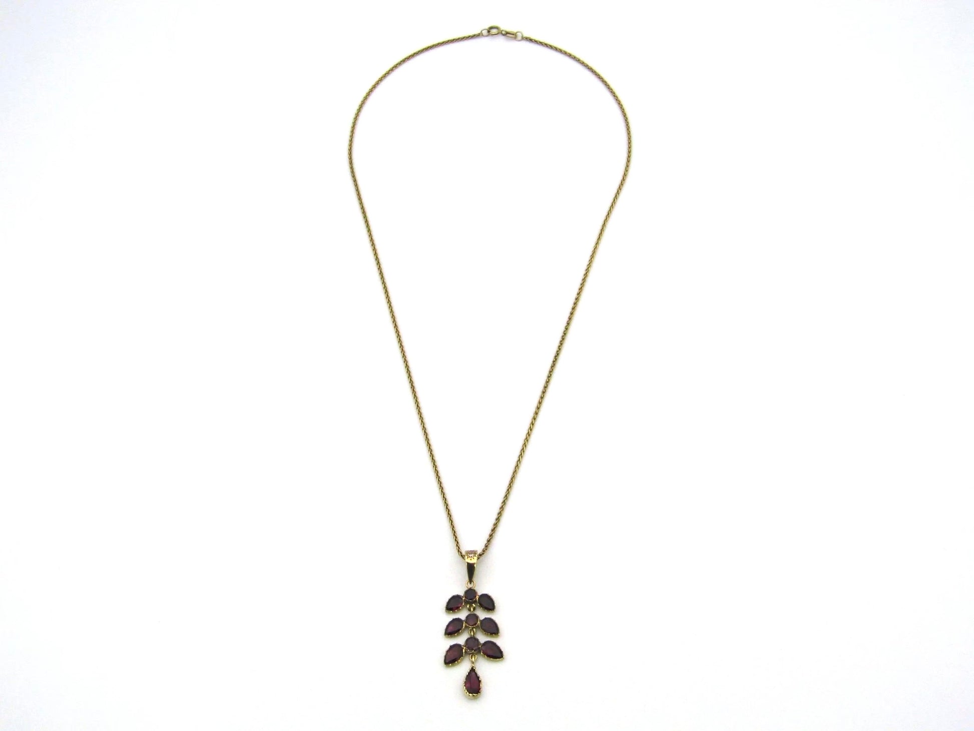 A Vintage 9K gold Almandine garnet and diamond pendant.
