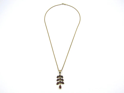 A Vintage 9K gold Almandine garnet and diamond pendant.