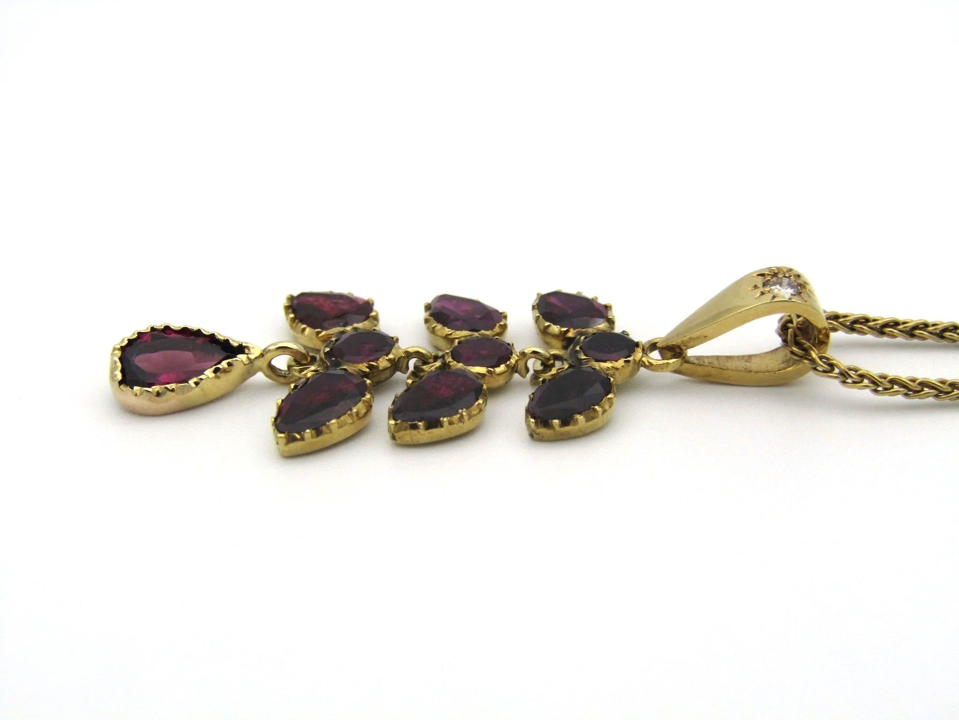 A Vintage 9K gold Almandine garnet and diamond pendant.