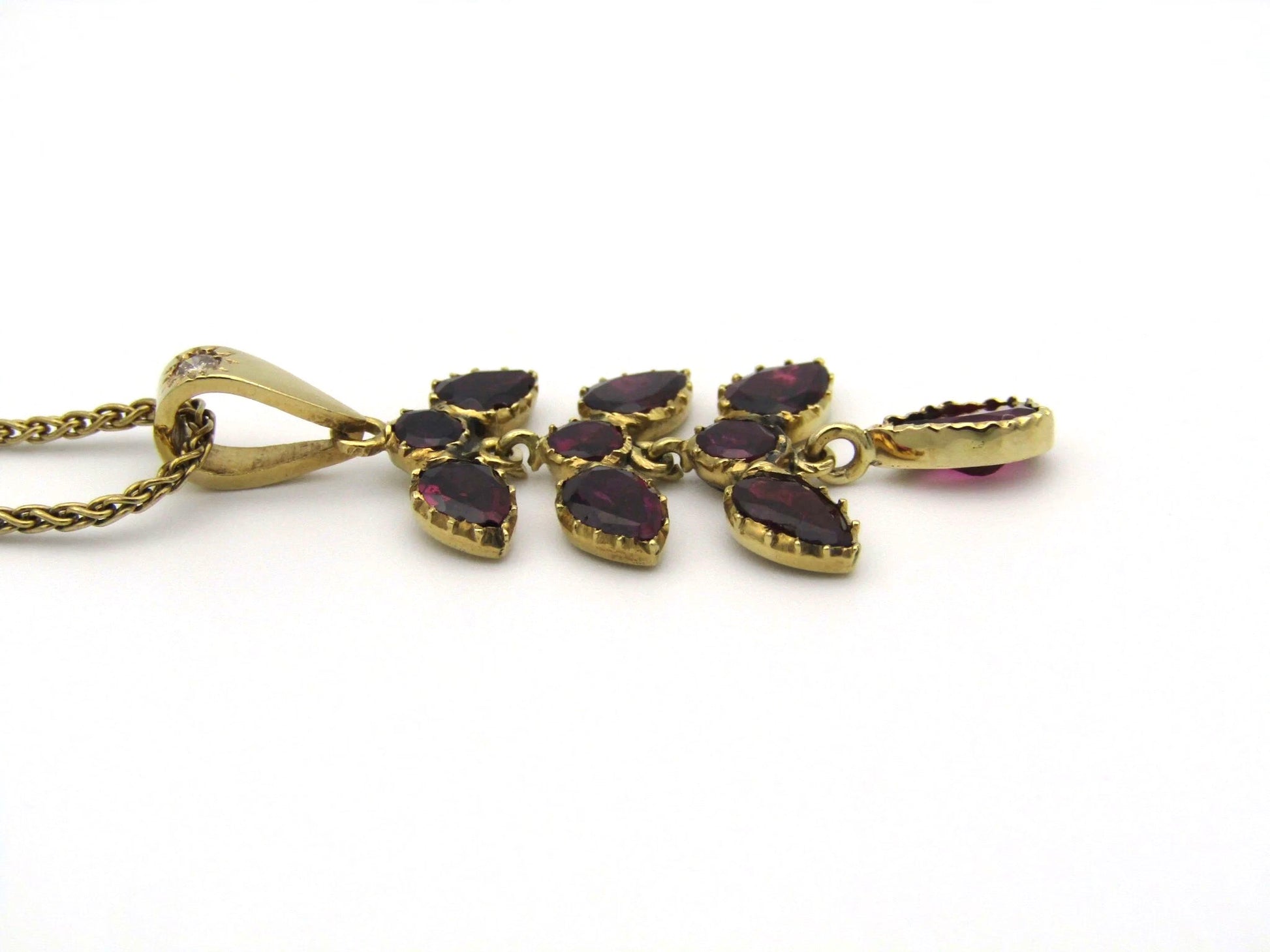 A Vintage 9K gold Almandine garnet and diamond pendant.